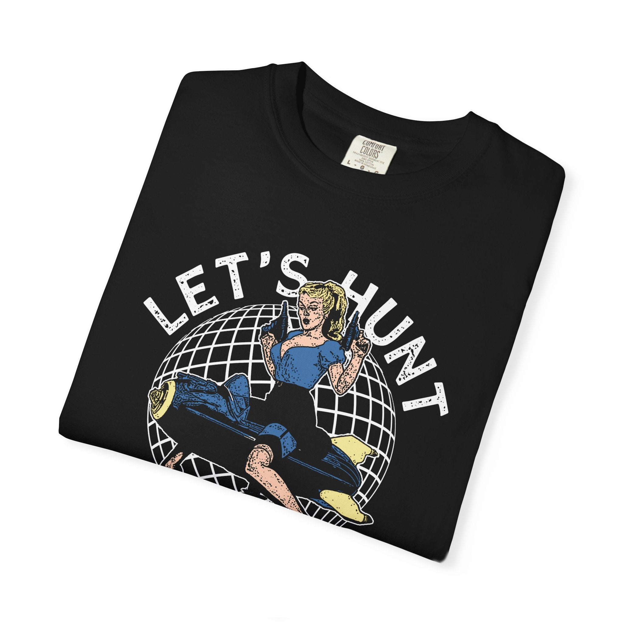 Black cotton t-shirt with retro graphic of blonde woman holding guns on globe and let’s hunt text arched above