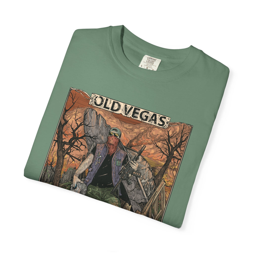 Olive green crewneck t-shirt featuring a detailed graphic of a rugged figure with a rifle against an orange desert labeled old vegas