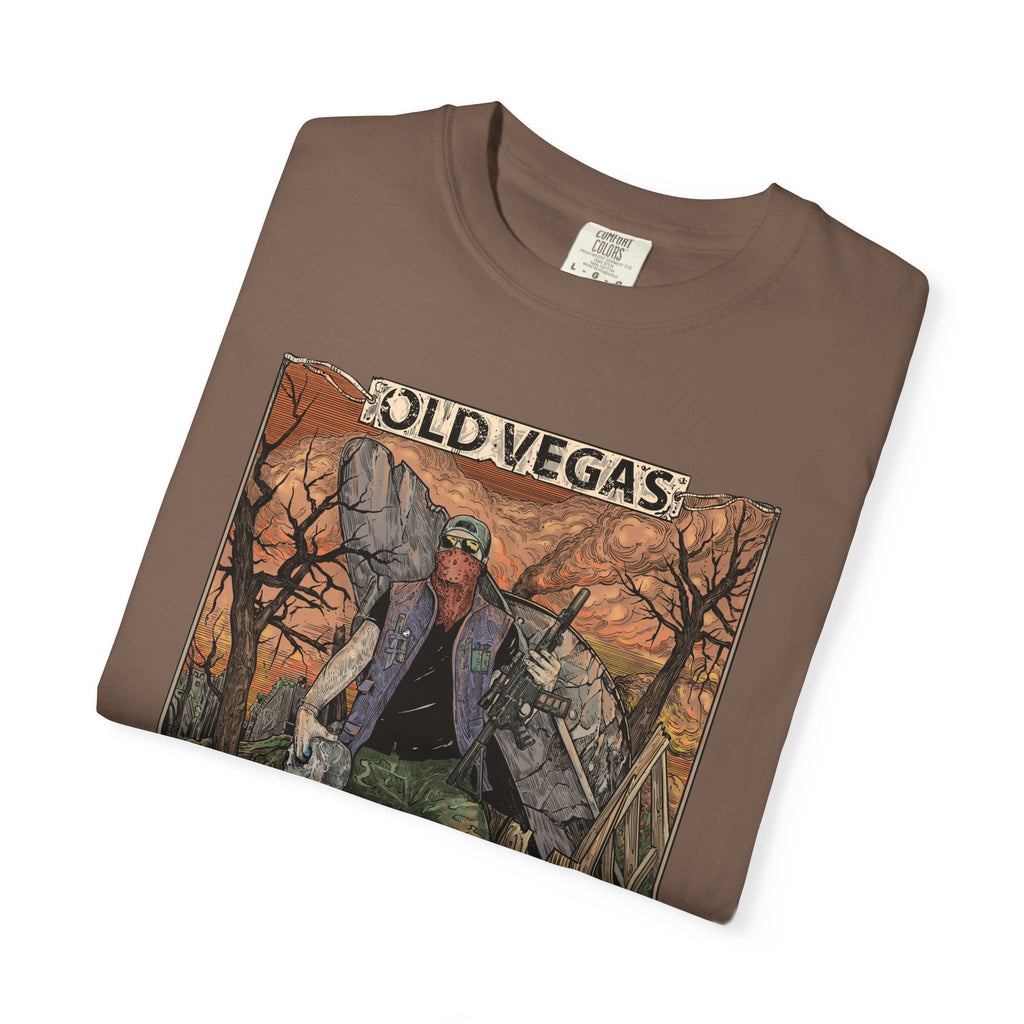 Brown cotton graphic tee featuring a rugged figure in old vegas themed illustration with warm orange and brown tones