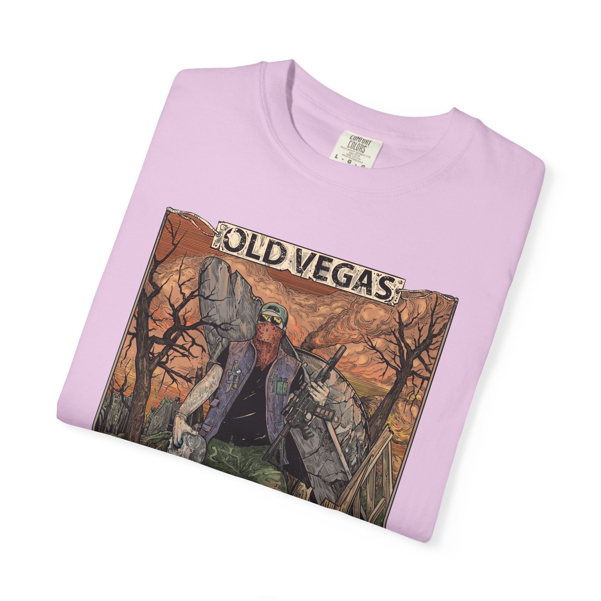 A soft lavender crewneck t-shirt featuring a detailed graphic of a rugged figure in an old vegas themed scene